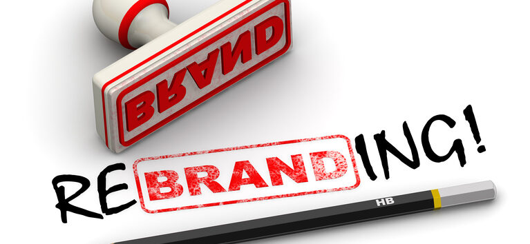 Red seal and imprint "BRAND" corrected to "REBRANDING!" on white surface. Isolated. 3D Illustration